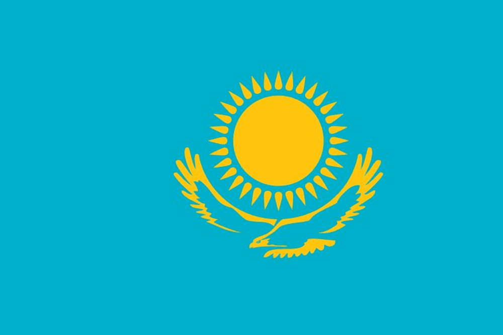 Kazakhstan flag with sun and eagle emblem.